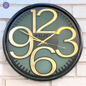 ساعت دیواری سبز‑طلایی ولدر مدل لاکچری مشکی براق