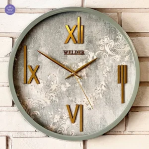 ساعت دیواری سبز‑طلایی طرح گل ولدر سبک نئو کلاسیک