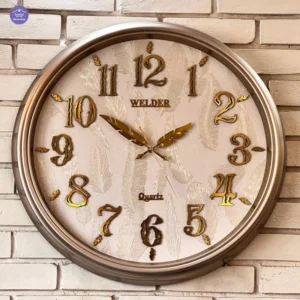 ساعت دیواری کرم‑طلایی ولدر با طراحی فانتزی و لوکس